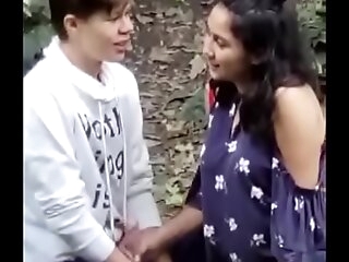 Indian girl outdoor with foreign scrounger